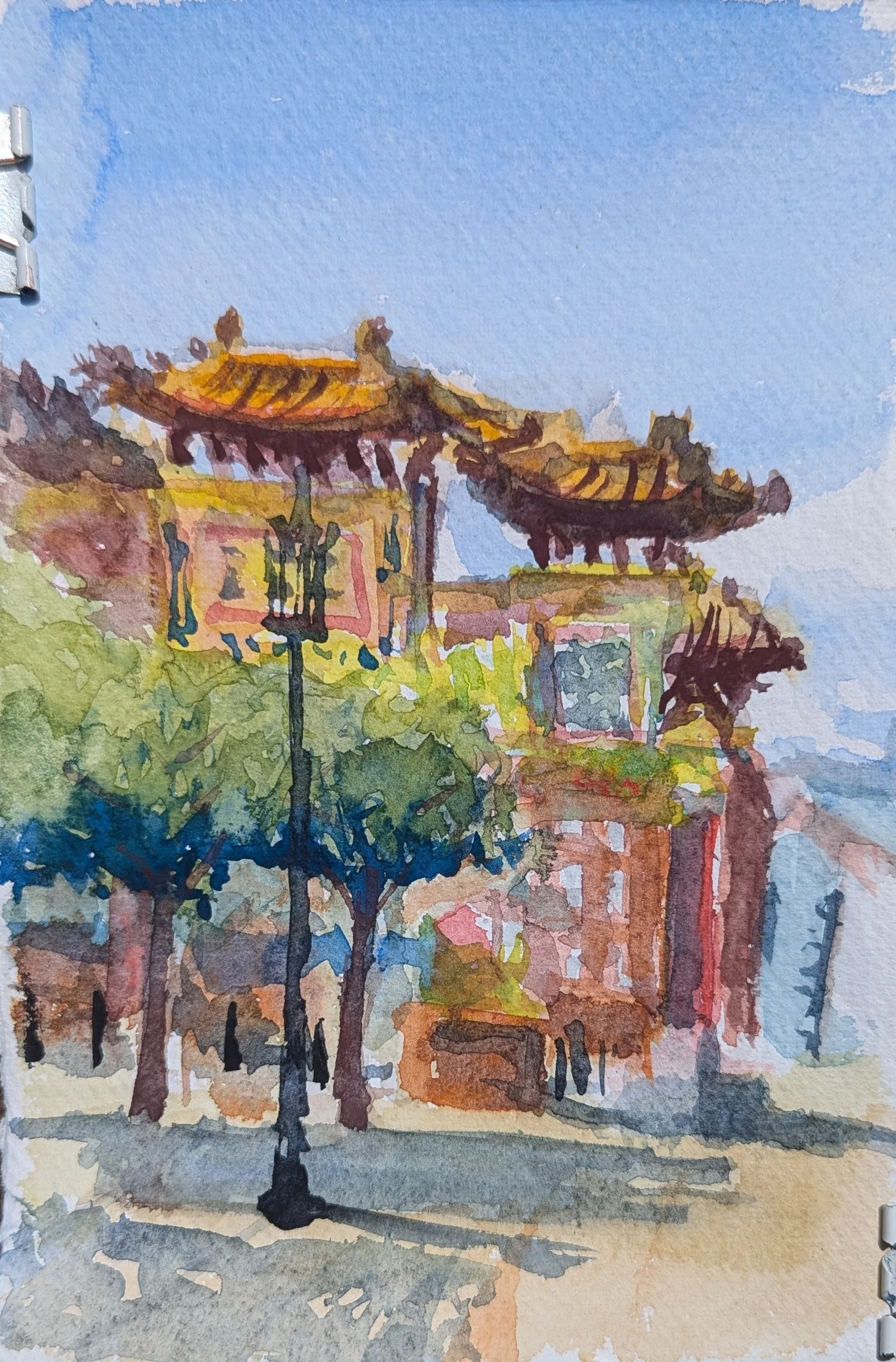 Ink and watercolour: Liverpool’s ornate Chinatown arch stands at Nelson Street, framed by trees and buildings.