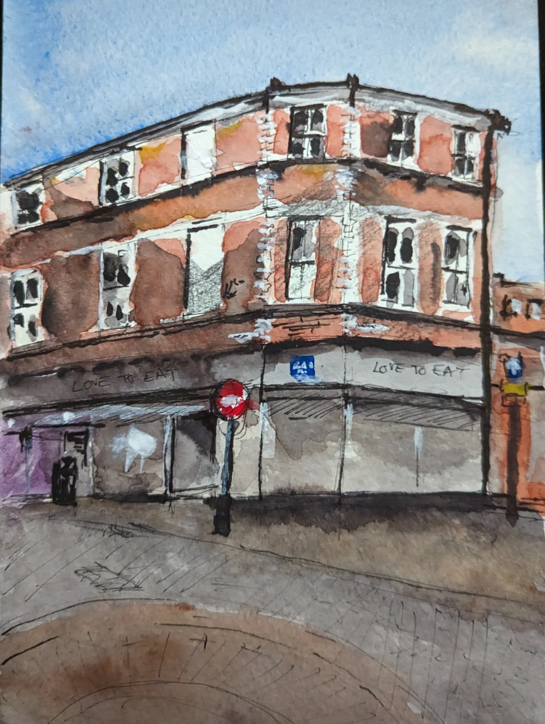 Ink and watercolour: A red-brick corner building rises above the Love to Eat shopfront near Ormskirk Clock Tower.