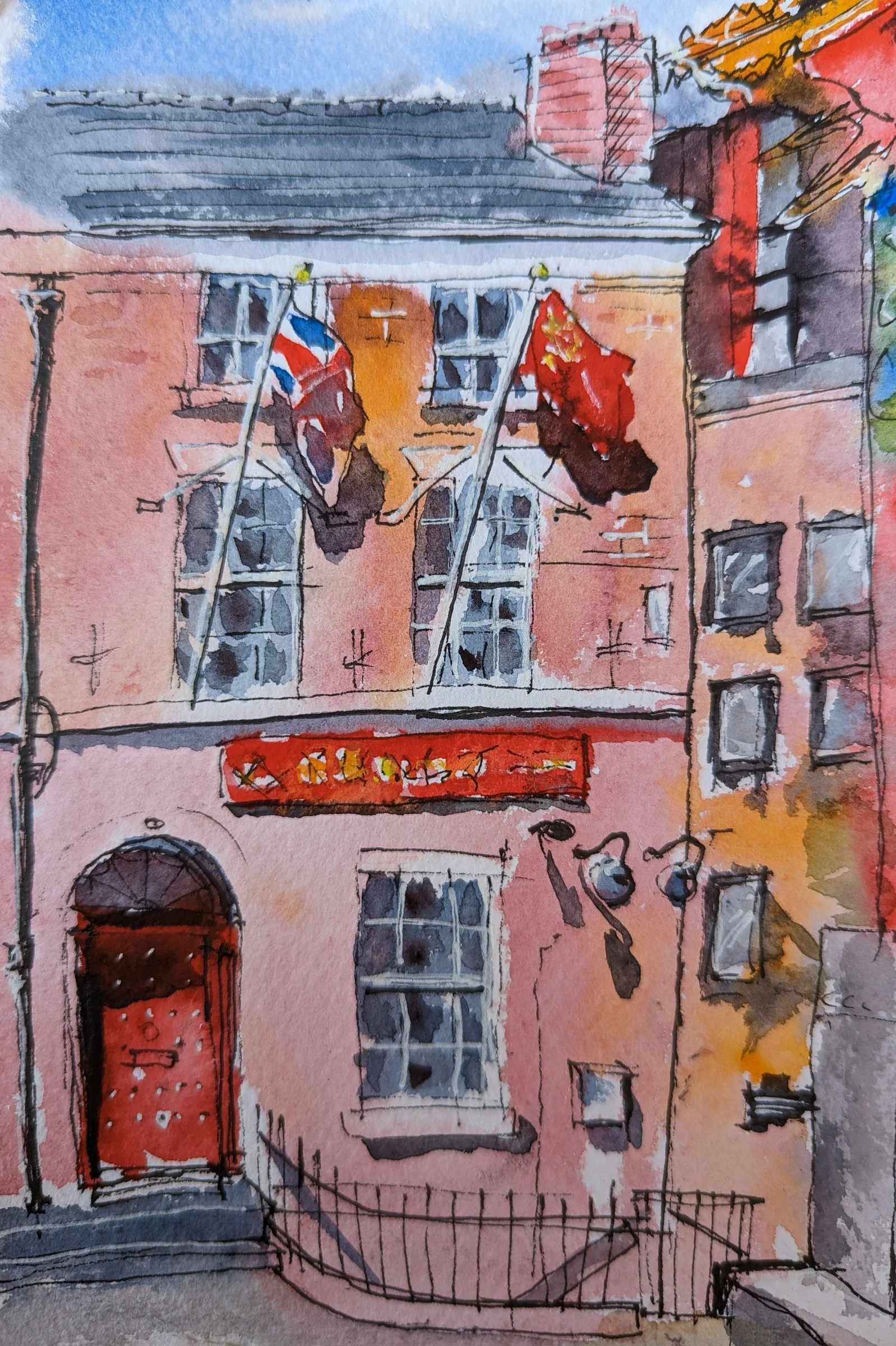 Ink and watercolour: A pink-fronted building with decorative details in Liverpool's Chinatown.