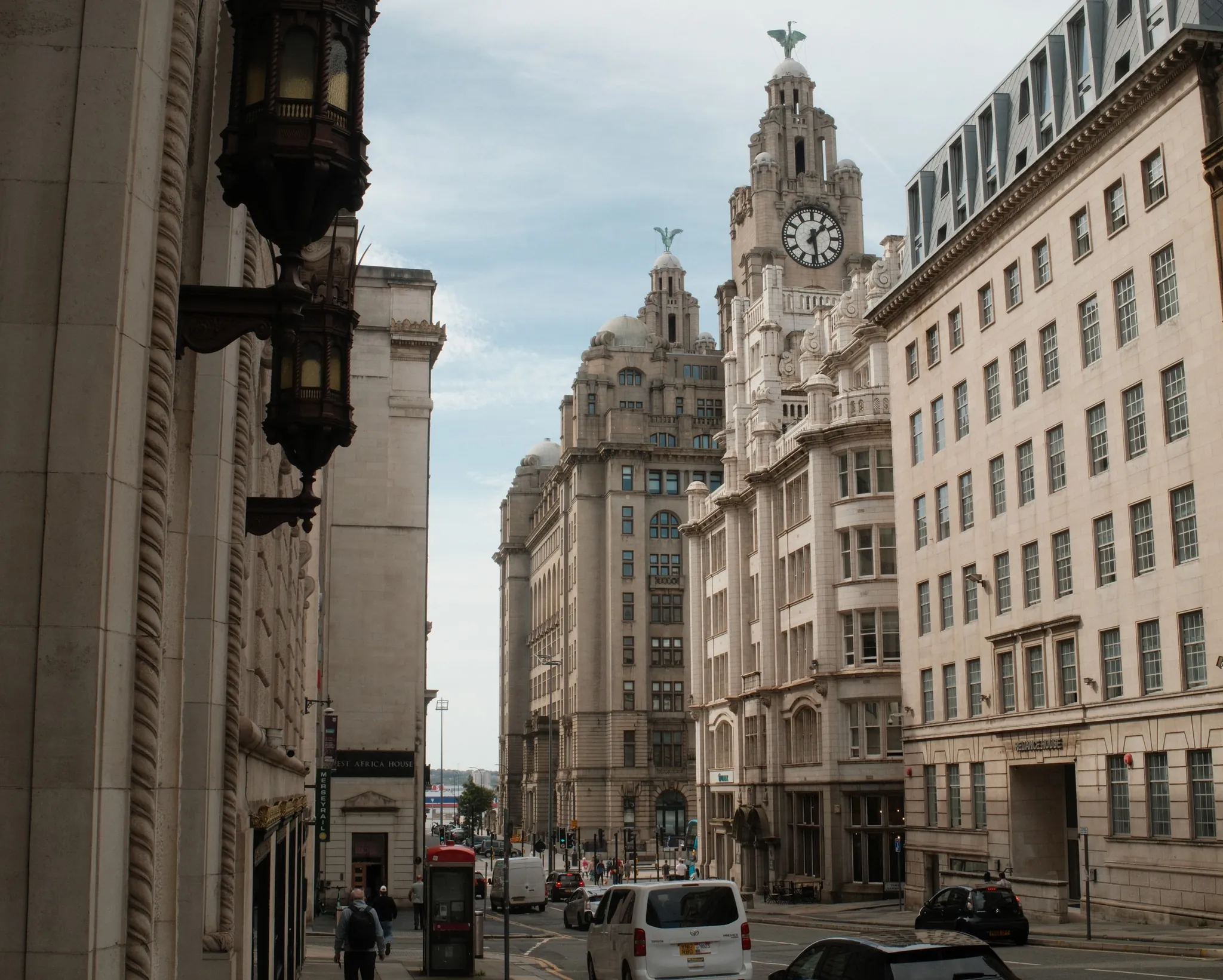 The Royal Liver Building’s clock tower is framed by the tall façades of Water Street.