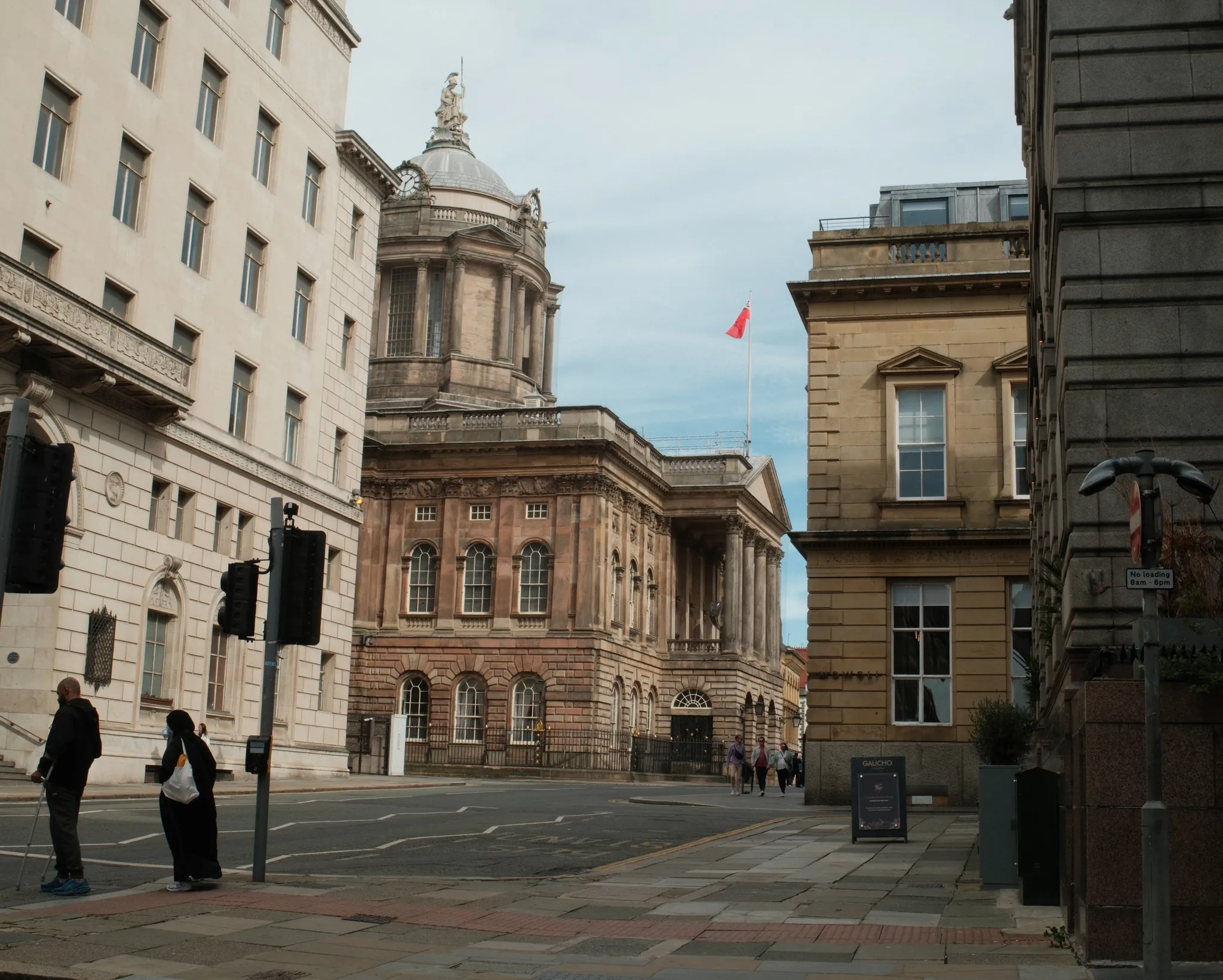 Liverpool Town Hall’s dome rises beyond traffic lights at the Water Street junction.