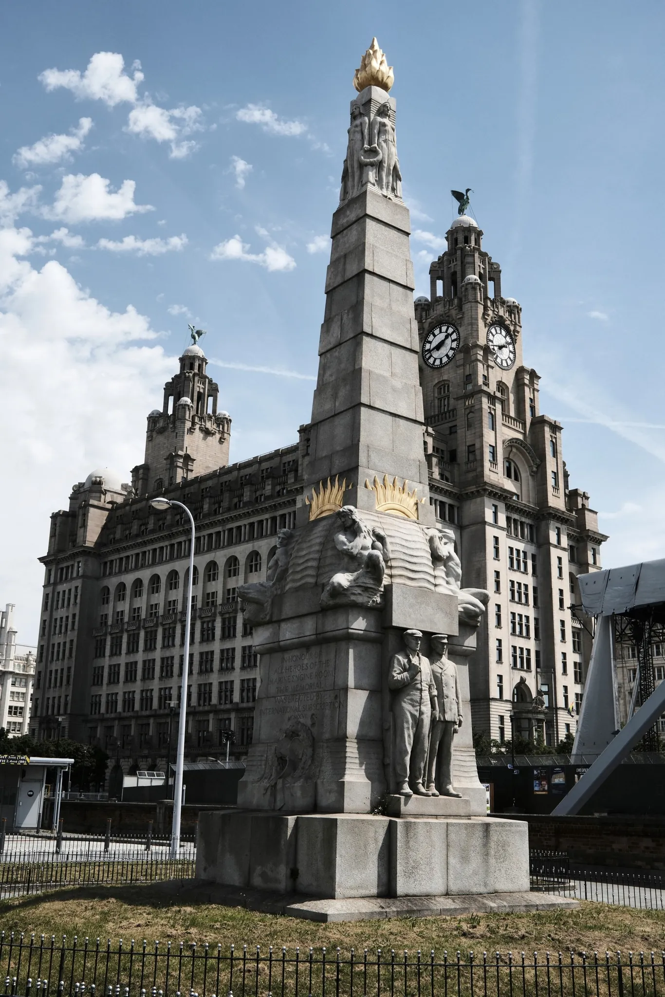 The memorial to the heroes of the marine engine room stands in front of the Royal Liver Building.