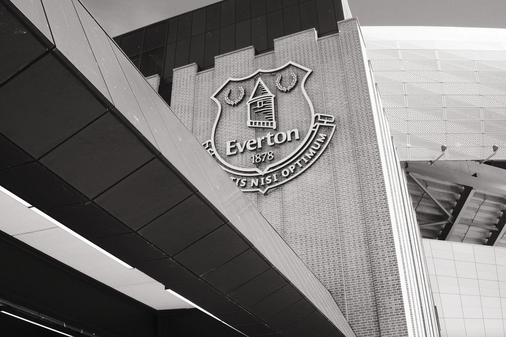 An angled view of the club crest on the exterior of Everton’s stadium.