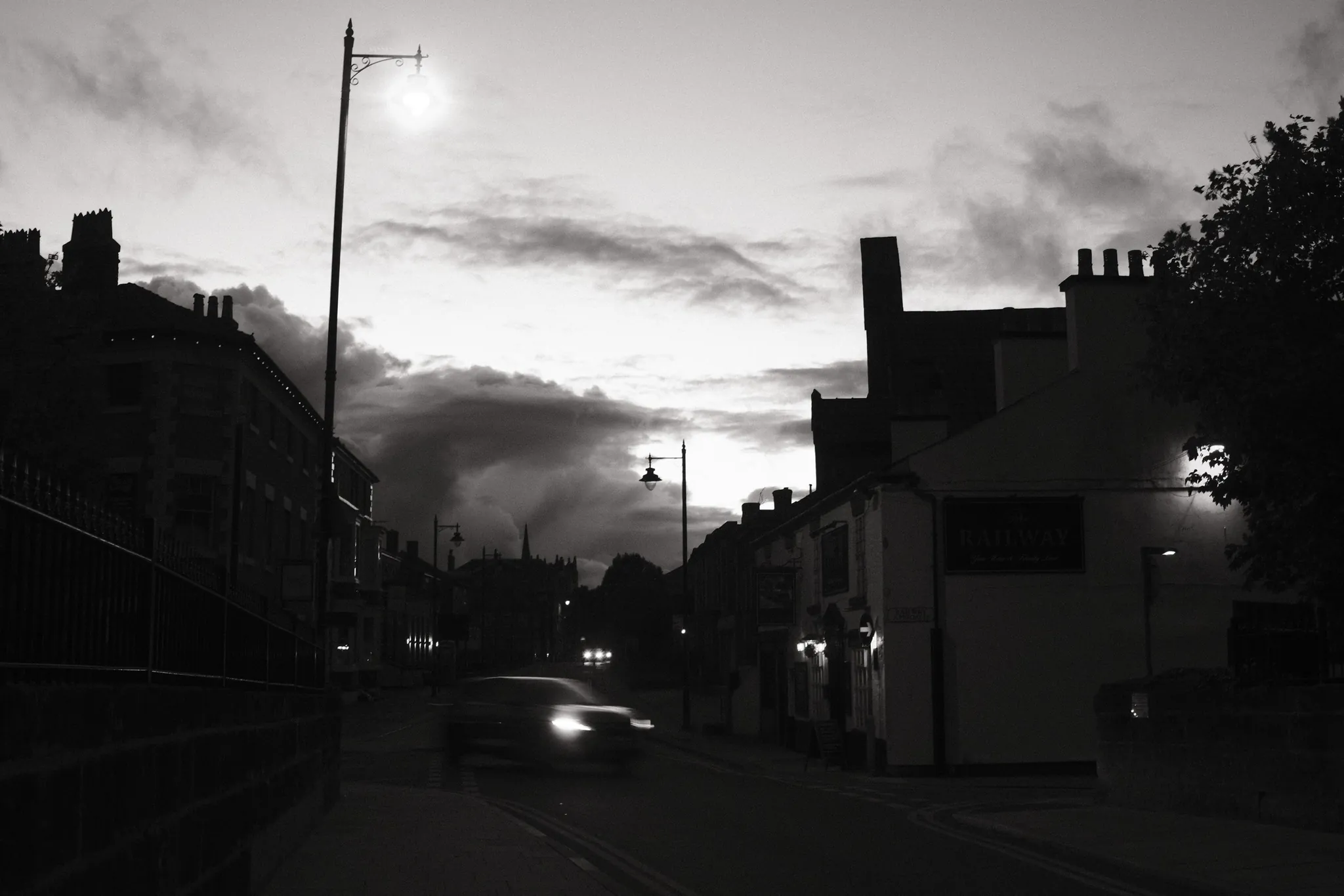 Evening light settles over Derby Street and the railway bridge in Ormskirk.